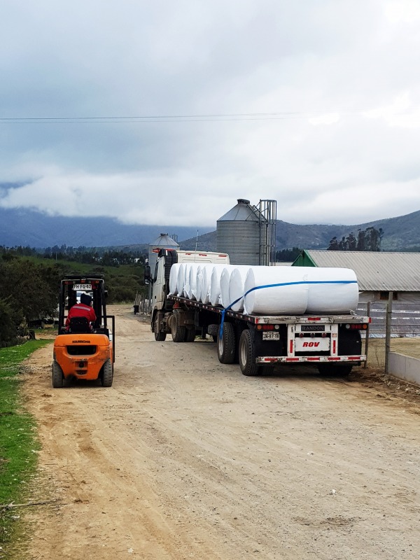 Chicken manure bales on truck